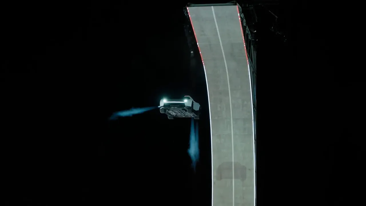 The Roadster beside the ramp in mid-air, a cold-gas jet blasting from its rear