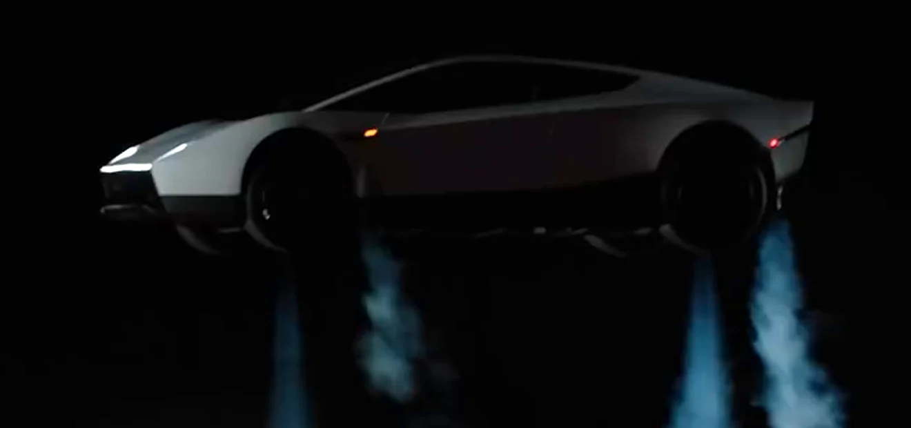 The Roadster in profile, mid-air above the pavement on four downward thruster jets